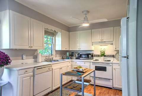 Kitchen featuring a small island perfect for meal prep or morning coffee, and stocked with all the essentials.