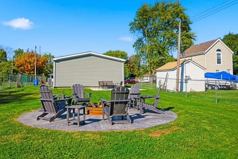Backyard with fire pit and plenty of seating to enjoy.