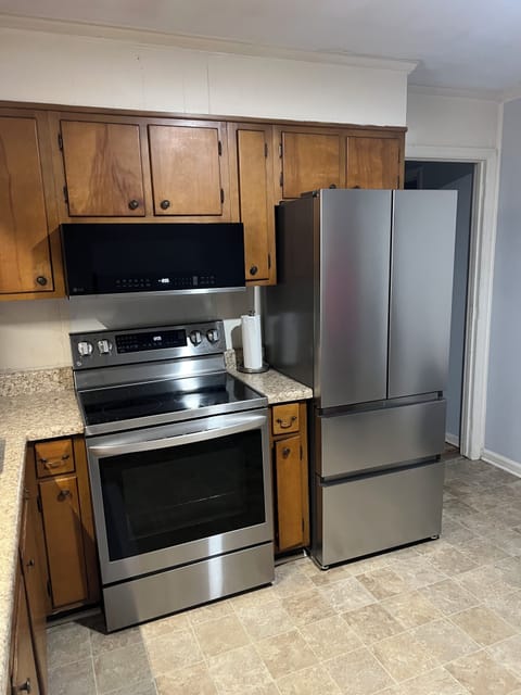 Stainless steel appliances with air fry function on stove