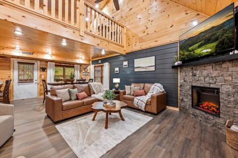 Cozy open living space with warm cabin charm.