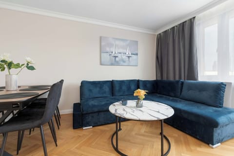Relax in the stylish living room with a comfortable sofa and modern decor.