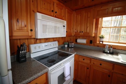 Microwave, stove with oven, knife set, toaster and more to assist with any cooking preparations 