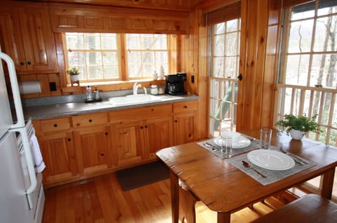 Updated kitchen with cabinets full of dishes, pots, pans, utensils and more to assist with meals large and small