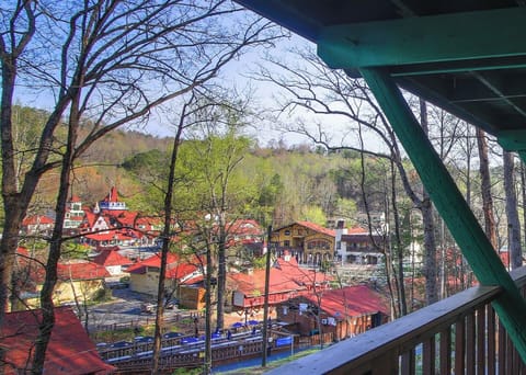 Unwind on the covered balcony as you take in the charming Bavarian-style village below, where vibrant rooftops and mountain views create the perfect backdrop for a peaceful escape.