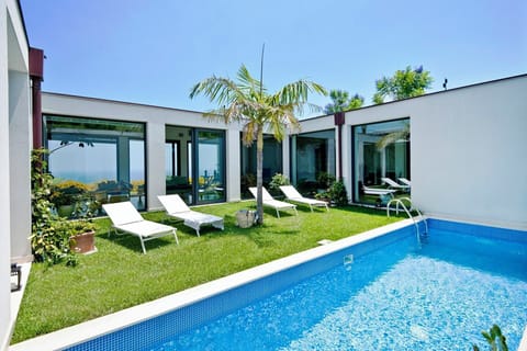 The internal courtyard pool has sea views via the living room windows.