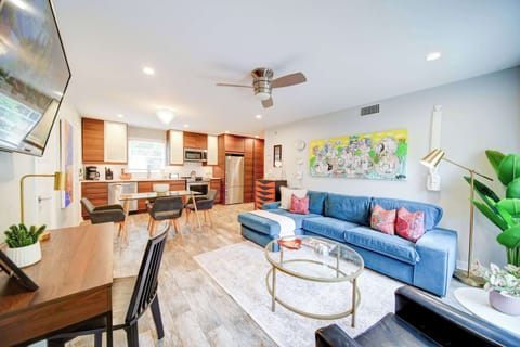 Sun-drenched living area featuring a large Smart TV and free Wi-Fi for your favorite streaming apps.