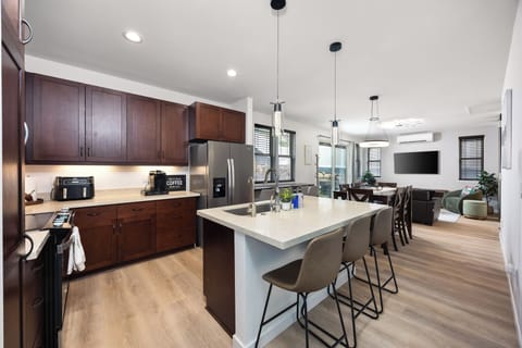 Modern kitchen with island seating and stainless steel appliances!