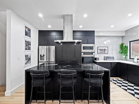 Clean, modern kitchen perfect for shared meals & morning coffee.