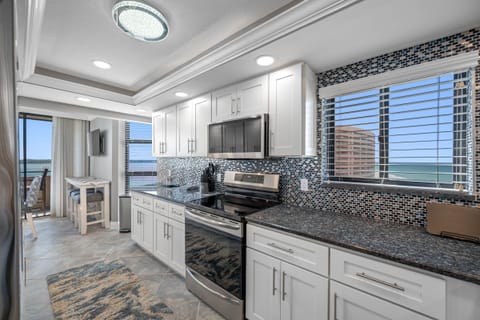 Kitchen with gorgeous tile work and amazing views!