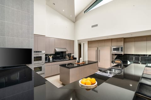 Main House Kitchen with Gas Range, Sub-Zero Refrigerator, and Double Oven