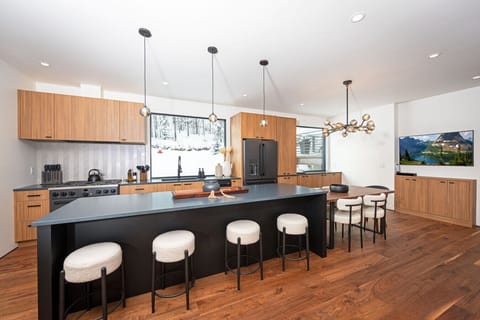 With big windows and lots of kitchen space, Elk Camp Chalet`s kitchen and dining room make the perfect gathering space.