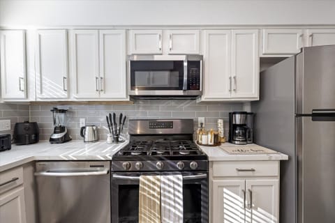 Ninja coffee machine with complimentary coffee, decaf, tea, sugar, cream, and sweetener.