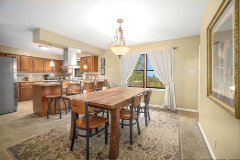 Whip up a delicious meal in the fully stocked kitchen and share it together in the dining room.