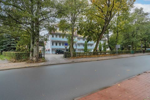 Peaceful street view surrounded by greenery, reflecting the calm and pleasant neighborhood around the apartment.