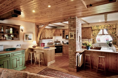 Dreamy farmhouse style, well equipped rustic kitchen.