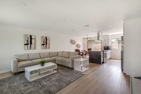 Bright open-concept living area with a comfortable sectional for movie nights