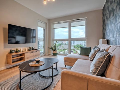 Living Room with Sofa Bed, Smart TV and Dining Table | Book Now with RENTUJEMY.COM