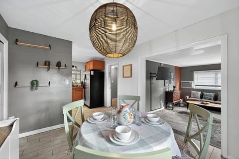 Open concept living with fully equipped kitchen, dining area, and entertainment