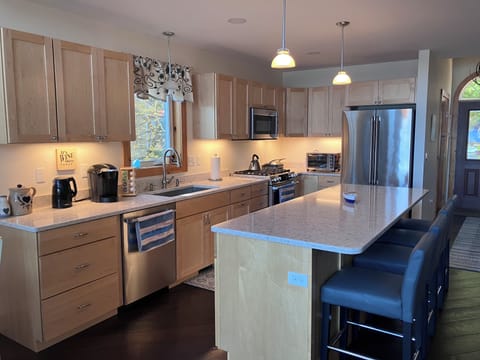 Kitchen with gas oven/stove, microwave, dishwasher, fridge, Keurig