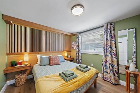 The cozy Bird of Paradise room features a comfortable custom-made queen-sized bed with unique mood l