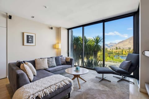 Light-filled living space with uninterrupted mountain views, designed for both comfort and quiet moments taking in the scenery.