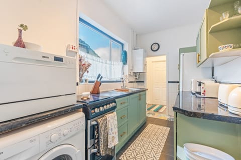 Cook with ease in the fully equipped kitchen, complete with all the cookware, utensils, and appliances you need for a home-cooked meal.