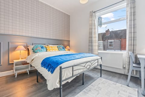 The master bedroom has a comfortable king size bed with fresh linen and towels provided.