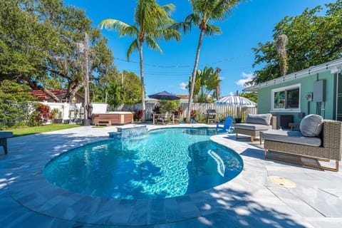 Dive into your resort-style pool surrounded by swaying palms, then unwind on the spacious patio with comfortable lounge seating - perfect for soaking up the sun or enjoying cocktails under the stars