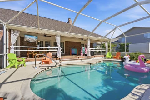 Easy living in your private pool oasis stocked with floats, lounges and Big TV