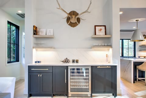 Wet Bar features Ice Machine, Mini Fridge and Wine Chiller