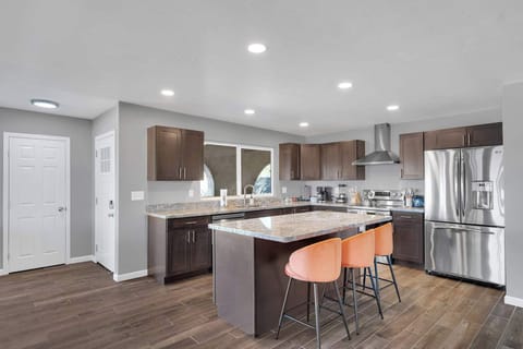 Enjoy meals in this bright dining area featuring a sleek table, comfortable seating, and modern décor. Perfect for sharing breakfast, planning your day, or enjoying a cozy dinner in.