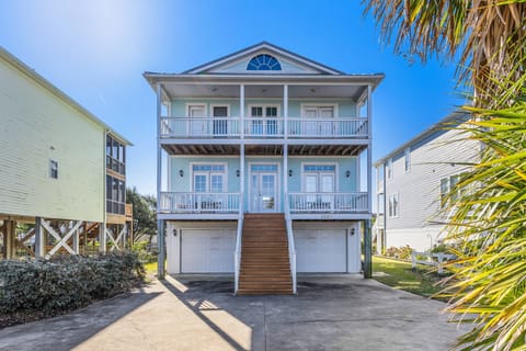 Front view of the home with ample parking and two balconies for relaxing and enjoying the fresh air.