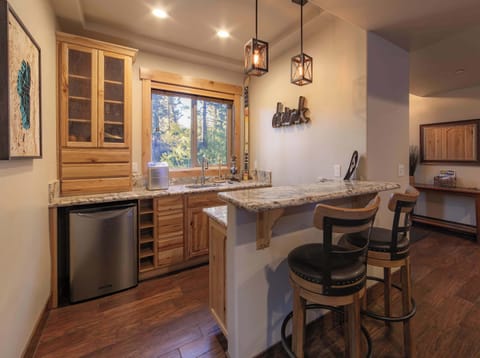 Game room with Smart TV, wet bar, and sectional seating