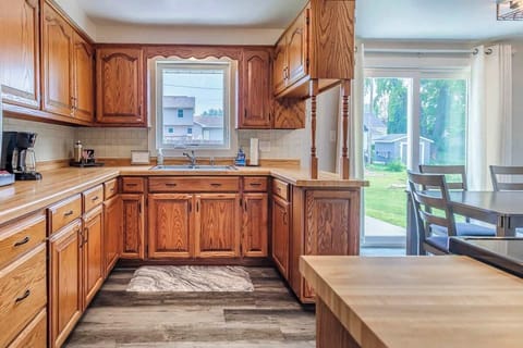 Another view of the kitchen showcasing modern appliances, ample counter space, and a functional layout for easy meal preparation.