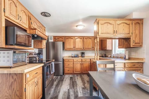 Bright kitchen conveniently labeled for ease—everything you need is organized and ready for your stay.
