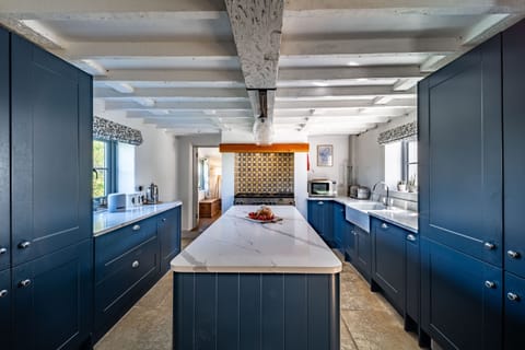 Ground floor: Kitchen / breakfast room with a Range oven with five gas burner, Butler's sink, fridge/ freezer and dishwasher