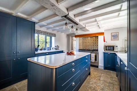 Ground floor: Kitchen / breakfast room with a Range oven with five gas burner, Butler's sink, fridge/ freezer and dishwasher