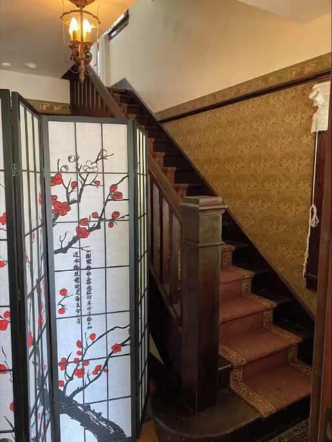 Stairs immediately upon entering to upper floor unit.