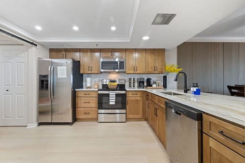 New completely renovated full stocked kitchen with quartz counter tops.