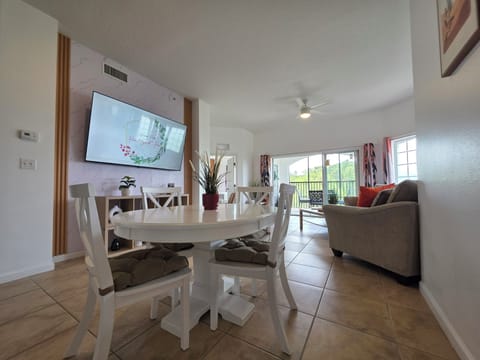 interior, indoor, climate control, couch, balcony, living area, television, dining table