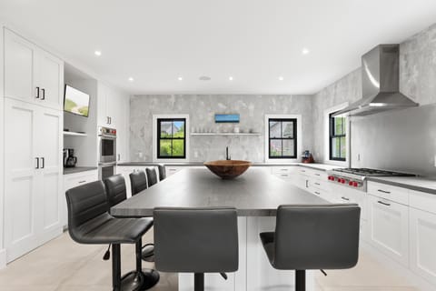 Light and bright kitchen ready for preparing a delicious meal. 