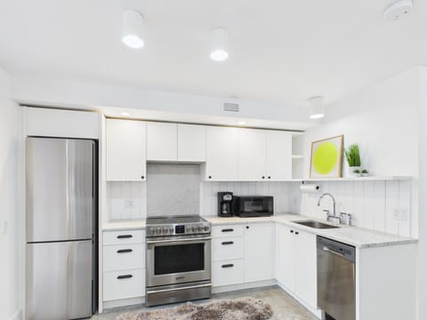 Stainless appliances and bright cabinetry
