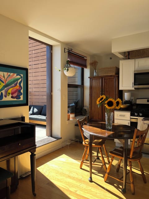 Dining table and sun-drenched private terrace