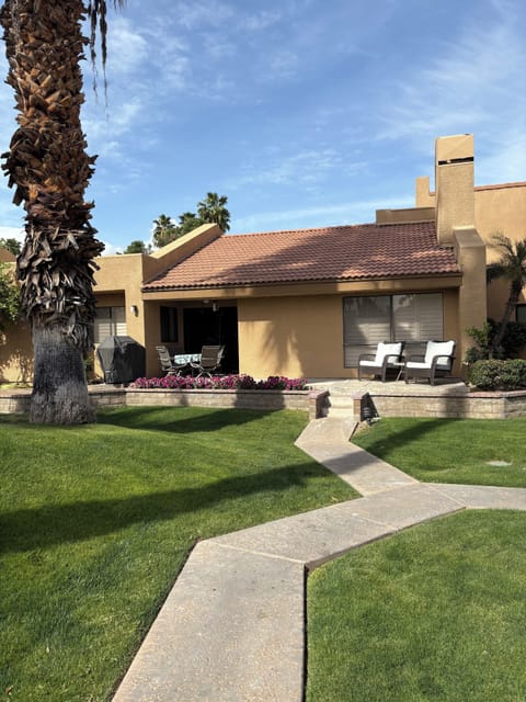 Private patio with table and chairs and grill for use.