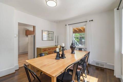 Our main-floor dining area features a warm wooden table perfect for family meals, casual gatherings, or enjoying a cozy breakfast together.