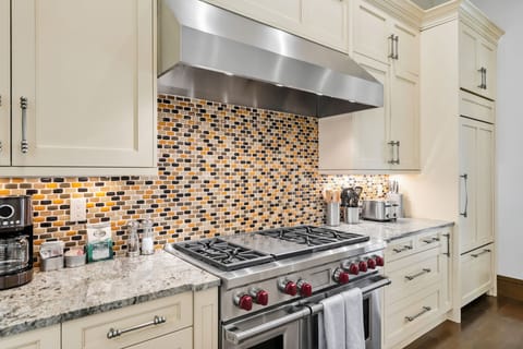 Kitchen: Main floor, Sub-Zero fridge, Wolf range, Keurig and drip coffee maker, Crockpot, toaster, cooking utensils, tableware