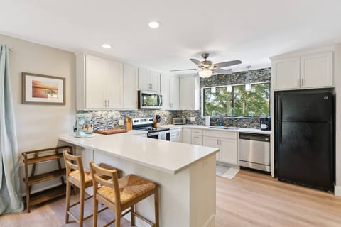 Your own beautiful, fully stocked kitchen with two bar-stools.
