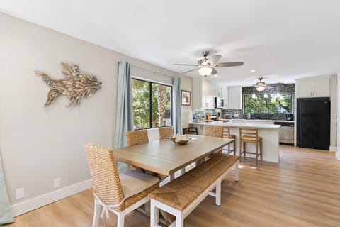 The whole family can gather here for meals at this open dining/kitchen space.