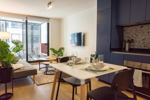 Modern living space with balcony access, perfect for relaxation and dining in style.