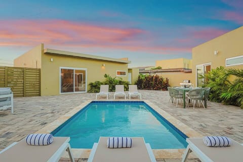 Take a refreshing dip in the pool, lounge in the sun, or gather around the outdoor dining table for unforgettable meals and memories.